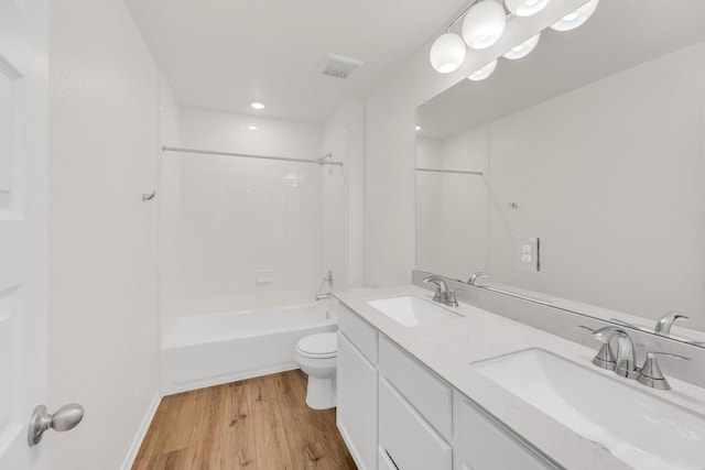4915 Mozzafiato Ln, Round Rock, TX 78665 - full bath featuring double vanity, wood finished floors,  shower combination, and recessed lighting