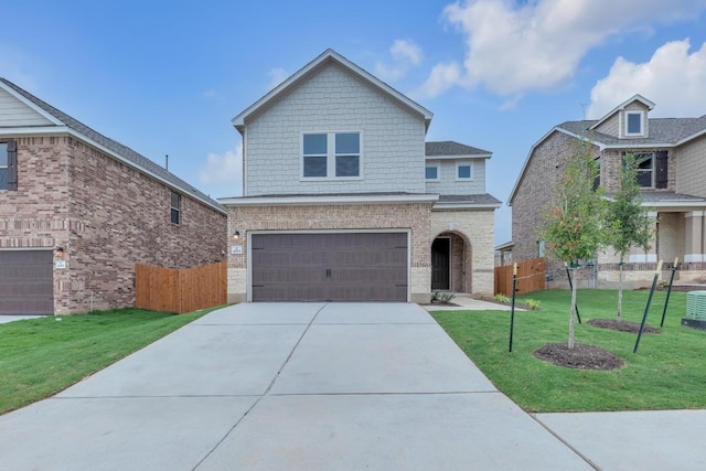 4915 Mozzafiato Ln, Round Rock, TX 78665 - traditional-style house featuring an attached garage and driveway
