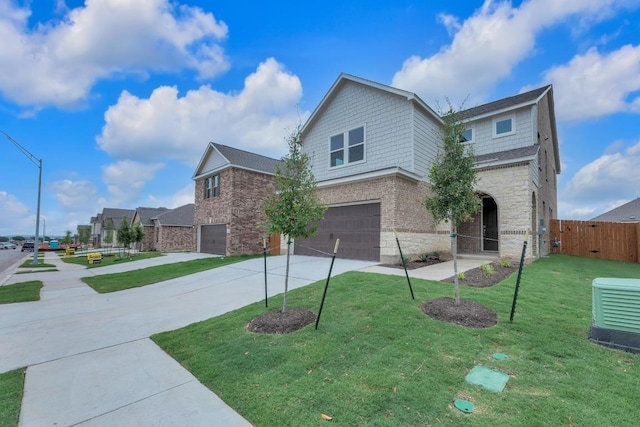 4915 Mozzafiato Ln, Round Rock, TX 78665 - traditional home with stone siding, a garage, and concrete driveway
