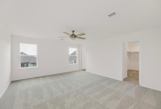 4915 Mozzafiato Ln, Round Rock, TX 78665 - empty room featuring plenty of natural light, carpet floors, and ceiling fan