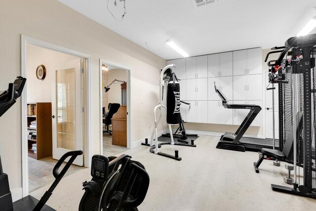 exercise room featuring visible vents