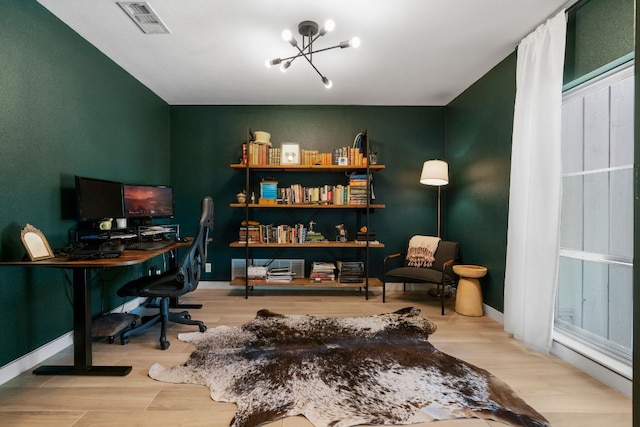 10100 Dobbin Dr, Austin, TX 78748 - office with wood finished floors, a chandelier, and baseboards