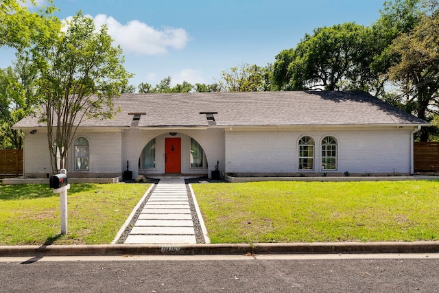 10100 Dobbin Dr, Austin, TX 78748 - ranch-style home featuring brick siding, a front yard, and roof with shingles