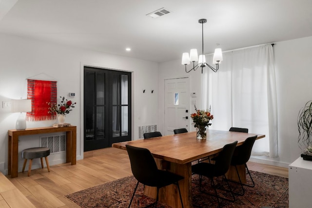 10100 Dobbin Dr, Austin, TX 78748 - dining area with light wood-type flooring, a chandelier, recessed lighting, and baseboards