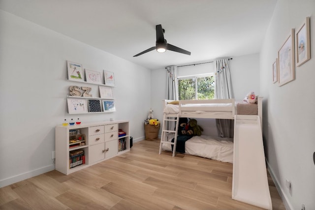 10100 Dobbin Dr, Austin, TX 78748 - bedroom featuring light wood-style flooring, baseboards, and a ceiling fan