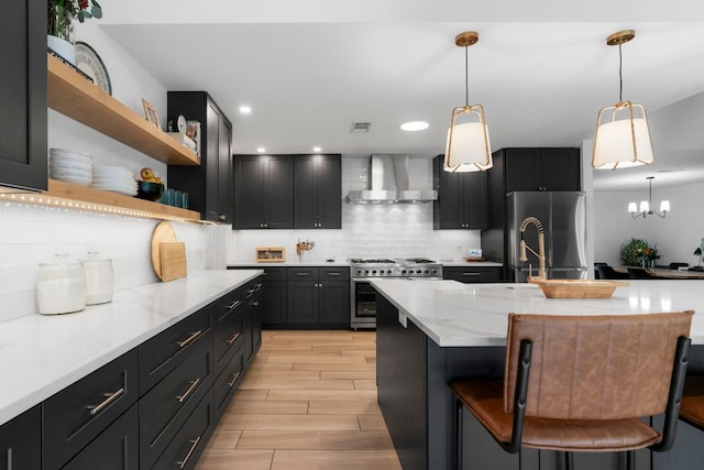 10100 Dobbin Dr, Austin, TX 78748 - kitchen featuring wall chimney range hood, stainless steel appliances, open shelves, backsplash, and recessed lighting