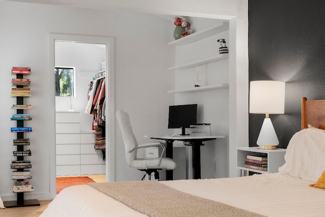 10100 Dobbin Dr, Austin, TX 78748 - bedroom featuring a spacious closet, a closet, and wood finished floors