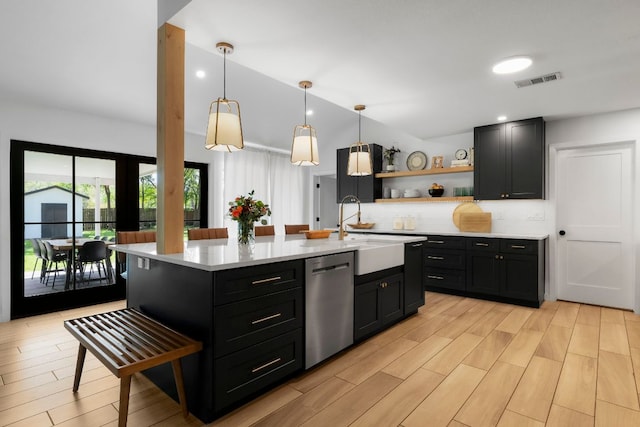 10100 Dobbin Dr, Austin, TX 78748 - kitchen featuring dishwasher, open shelves, light countertops, dark cabinetry, and decorative backsplash