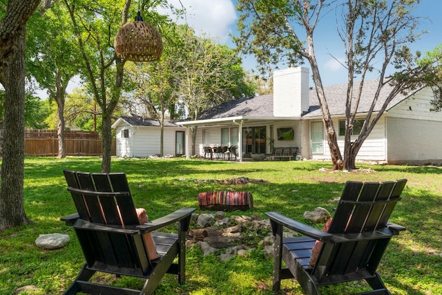 10100 Dobbin Dr, Austin, TX 78748 - rear view of house featuring a chimney, brick siding, and a patio area