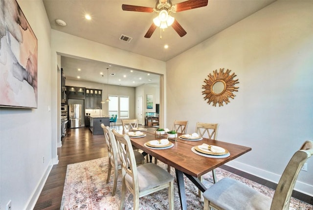 12113 Beautybrush Dr, Austin, TX 78738 - dining area featuring dark wood-style floors, ceiling fan, and recessed lighting
