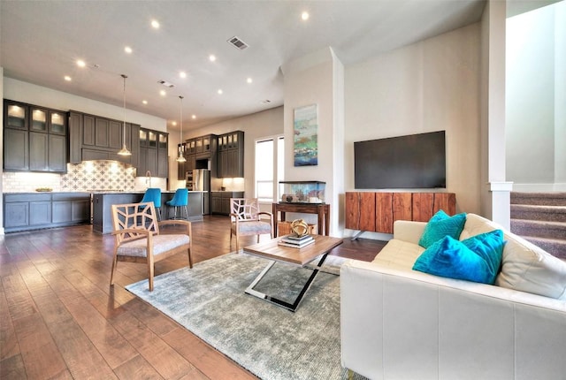 12113 Beautybrush Dr, Austin, TX 78738 - living room featuring dark wood-style flooring, recessed lighting, and stairway
