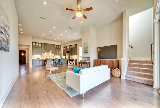 12113 Beautybrush Dr, Austin, TX 78738 - living room with stairway, wood-type flooring, ceiling fan, and recessed lighting