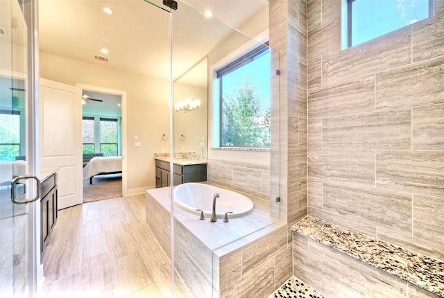 12113 Beautybrush Dr, Austin, TX 78738 - full bathroom with a stall shower, vanity, a bath, and ensuite bath