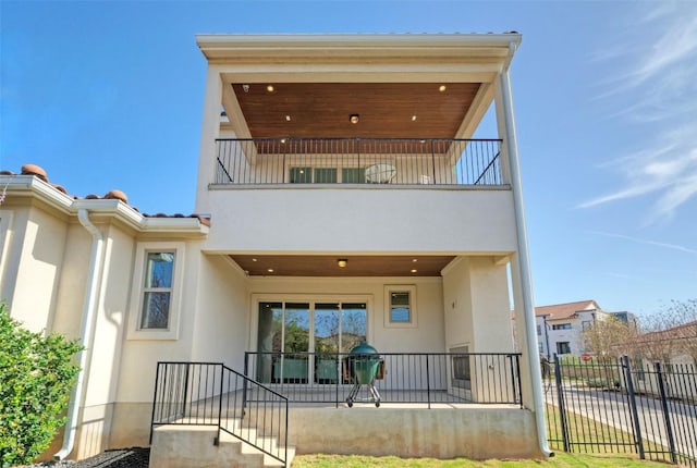 12113 Beautybrush Dr, Austin, TX 78738 - back of property featuring a balcony and stucco siding