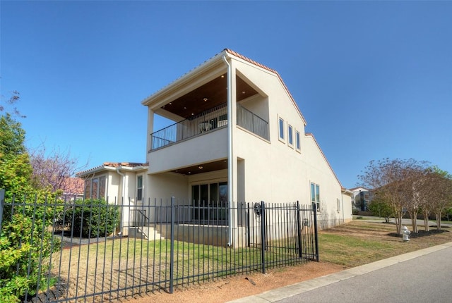 12113 Beautybrush Dr, Austin, TX 78738 - view of property exterior featuring a balcony and stucco siding