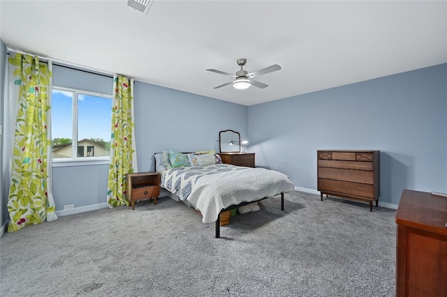 carpeted bedroom featuring a ceiling fan, baseboards, and visible vents