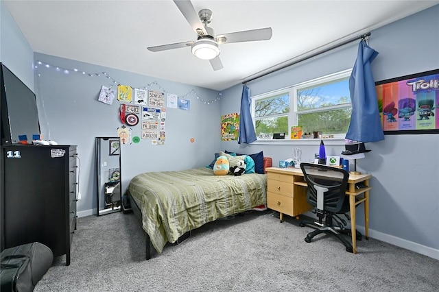 carpeted bedroom featuring baseboards and ceiling fan