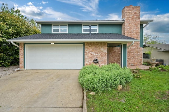 view of front of home with a chimney, a garage, brick siding, cooling unit, and concrete driveway