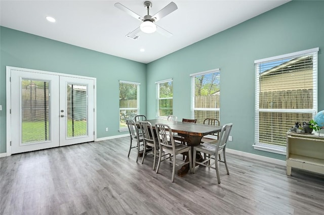 dining area featuring baseboards, ceiling fan, french doors, and wood finished floors