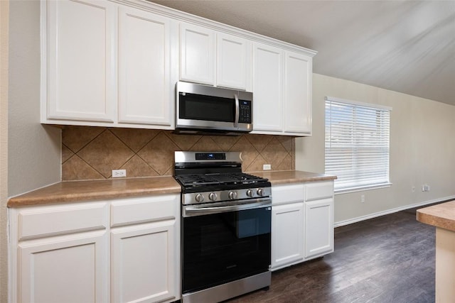 4009 Veiled Falls Dr, Pflugerville, TX 78660 - kitchen featuring stainless steel appliances, white cabinetry, decorative backsplash, and dark wood-style flooring