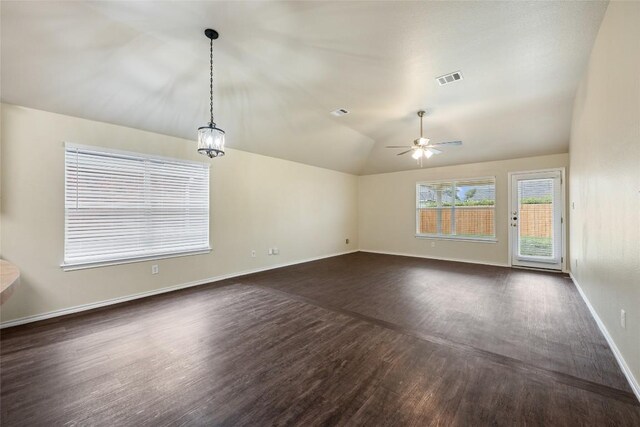4009 Veiled Falls Dr, Pflugerville, TX 78660 - spare room featuring dark wood-style flooring, lofted ceiling, and a ceiling fan