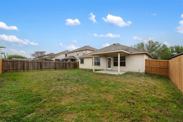 4009 Veiled Falls Dr, Pflugerville, TX 78660 - rear view of house featuring a patio, a lawn, and a fenced backyard