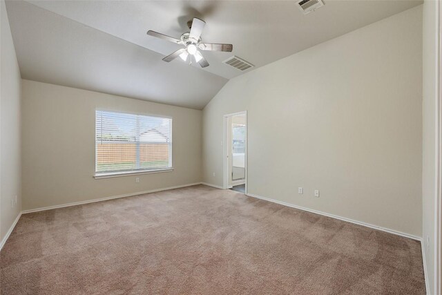 4009 Veiled Falls Dr, Pflugerville, TX 78660 - empty room featuring light carpet, vaulted ceiling, visible vents, and a ceiling fan