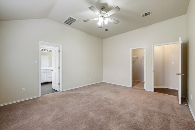 4009 Veiled Falls Dr, Pflugerville, TX 78660 - unfurnished bedroom featuring lofted ceiling, carpet flooring, a walk in closet, connected bathroom, and a closet