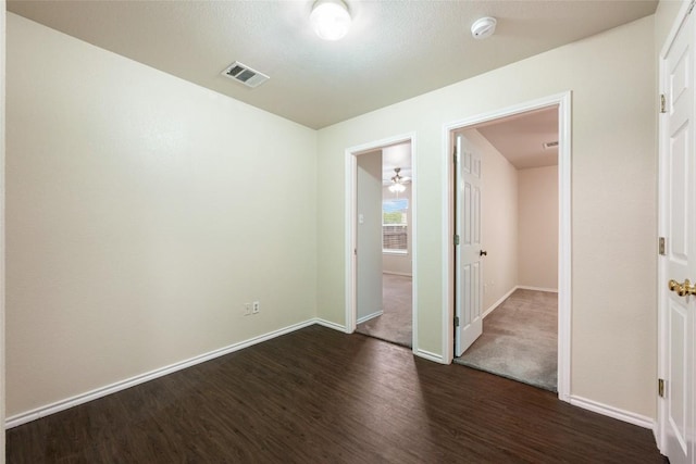 4009 Veiled Falls Dr, Pflugerville, TX 78660 - unfurnished bedroom with dark wood-type flooring and baseboards