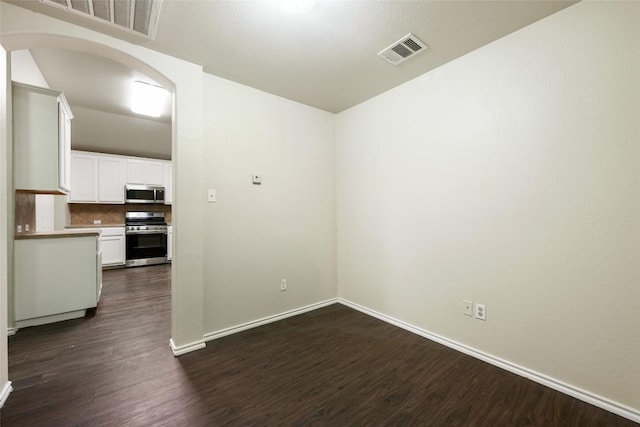 4009 Veiled Falls Dr, Pflugerville, TX 78660 - unfurnished room with dark wood-type flooring and arched walkways
