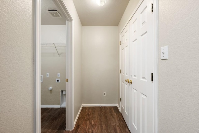 4009 Veiled Falls Dr, Pflugerville, TX 78660 - hallway featuring dark wood-type flooring and a textured wall