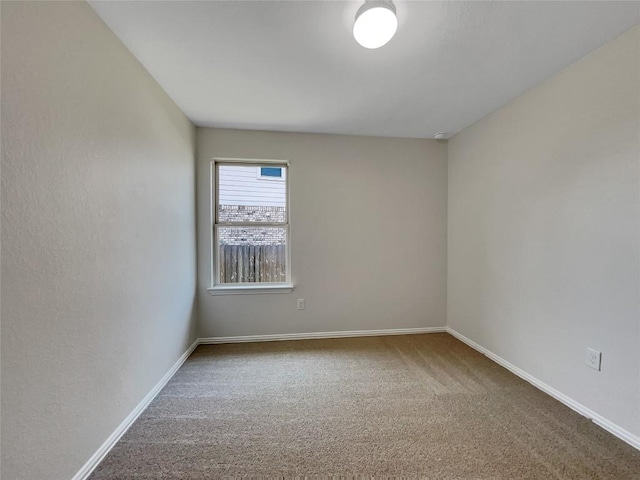 137 Periwinkle Ln, Bastrop, TX 78602 - carpeted empty room with baseboards