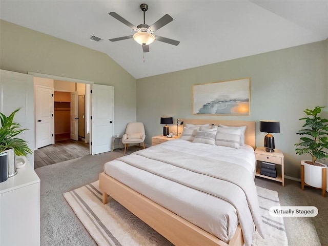 137 Periwinkle Ln, Bastrop, TX 78602 - carpeted bedroom with lofted ceiling and ceiling fan