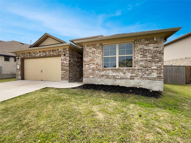 137 Periwinkle Ln, Bastrop, TX 78602 - view of front facade featuring driveway, a garage, and brick siding
