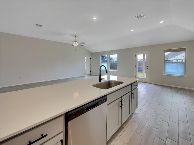 137 Periwinkle Ln, Bastrop, TX 78602 - kitchen with dishwasher, lofted ceiling, open floor plan, light countertops, and a ceiling fan