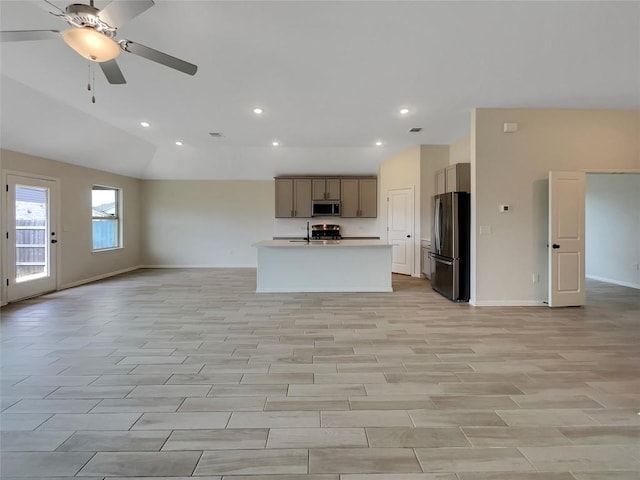 137 Periwinkle Ln, Bastrop, TX 78602 - unfurnished living room featuring a ceiling fan, recessed lighting, and lofted ceiling