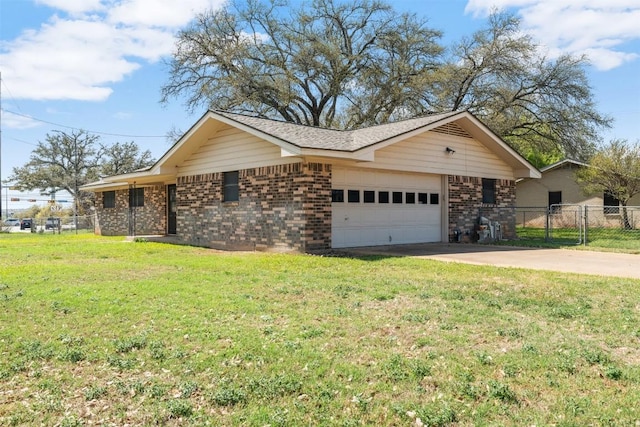 view of front of property with concrete driveway, fence, an attached garage, a front lawn, and brick siding