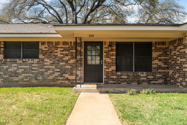 entrance to property with brick siding