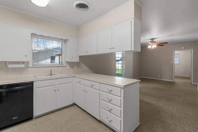kitchen with light countertops, a sink, dishwasher, a peninsula, and visible vents