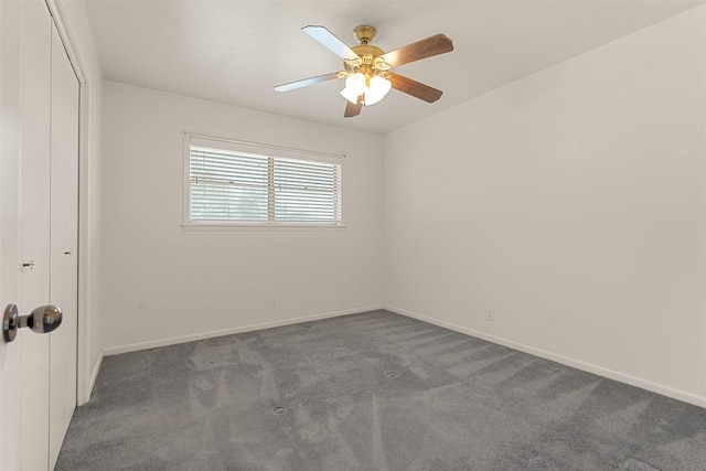 unfurnished bedroom featuring carpet floors, a closet, baseboards, and ceiling fan