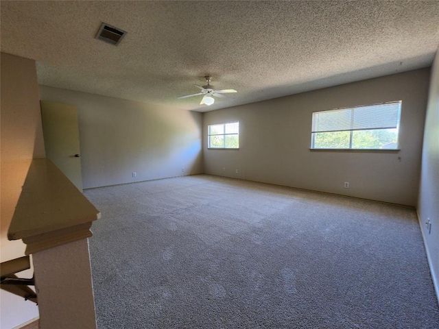 2516 Glen Field Dr, Cedar Park, TX 78613 - carpeted spare room featuring a textured ceiling, visible vents, and a ceiling fan