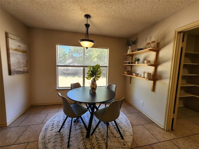 2516 Glen Field Dr, Cedar Park, TX 78613 - dining area with light tile patterned flooring and a textured ceiling
