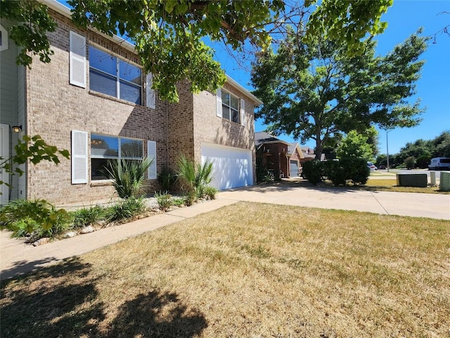 2516 Glen Field Dr, Cedar Park, TX 78613 - view of home's exterior with concrete driveway, a garage, brick siding, and a lawn