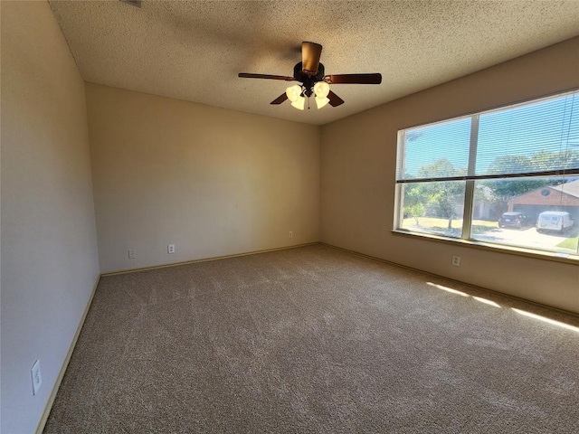 2516 Glen Field Dr, Cedar Park, TX 78613 - spare room with baseboards, carpet floors, a textured ceiling, and a ceiling fan
