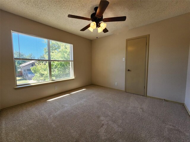 2516 Glen Field Dr, Cedar Park, TX 78613 - spare room with a textured ceiling, carpet flooring, and a ceiling fan