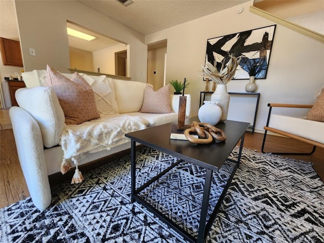 2516 Glen Field Dr, Cedar Park, TX 78613 - living room with a textured ceiling and wood finished floors
