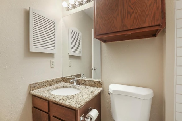 1407 W Braker Ln Unit B, Austin, TX 78758 - half bath featuring vanity and toilet