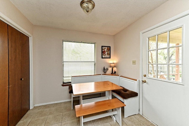 1306 Daytona Dr, Austin, TX 78733 - dining area featuring a textured ceiling, breakfast area, and light tile patterned floors