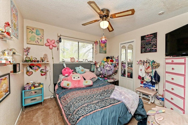 1306 Daytona Dr, Austin, TX 78733 - carpeted bedroom featuring a textured ceiling, a ceiling fan, and a closet