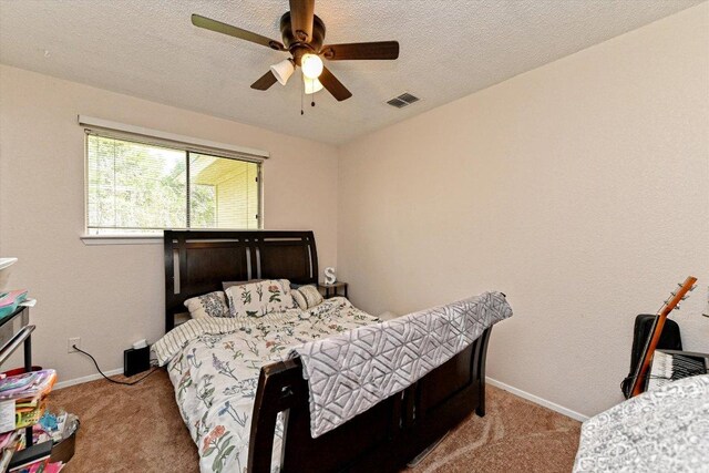 1306 Daytona Dr, Austin, TX 78733 - carpeted bedroom featuring a ceiling fan and a textured ceiling